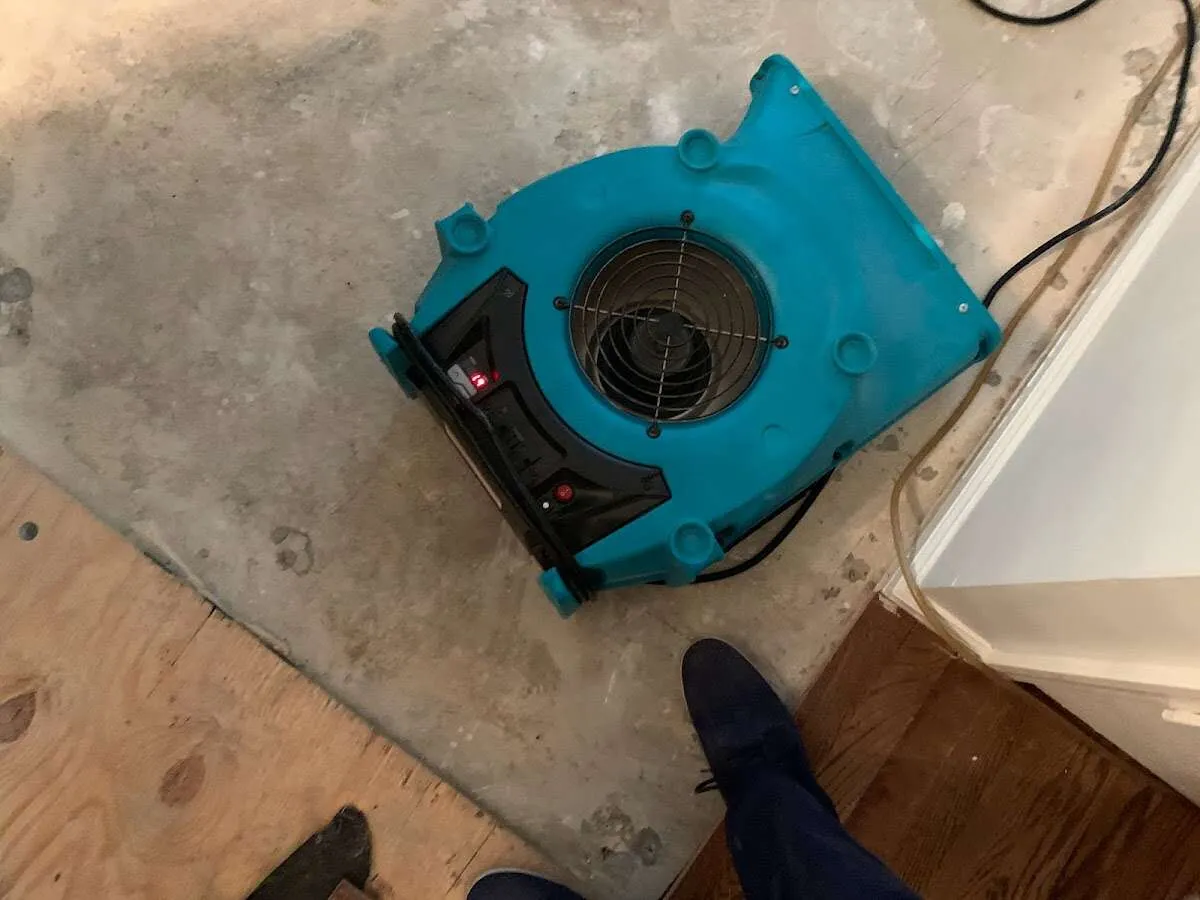 Air mover drying subfloor during Leak Detection & Repair in Saratoga Springs